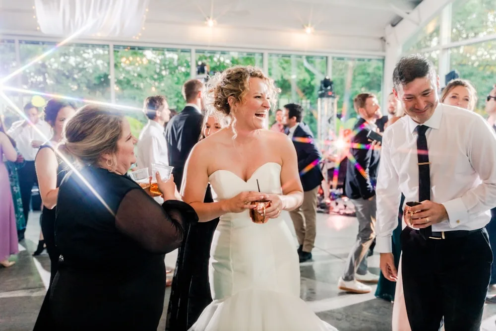 A bride and groom laughing with each other